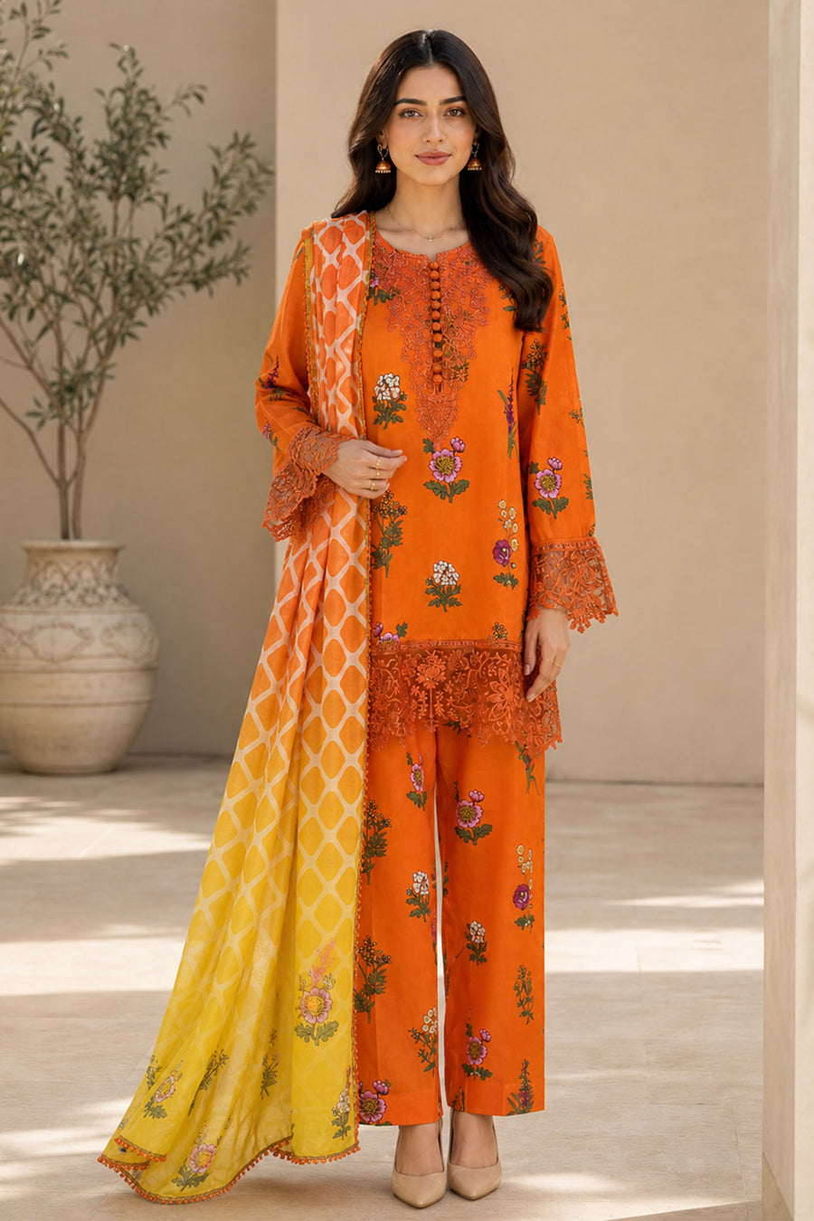 A Kleren embroidered printed lawn 3-piece on a model